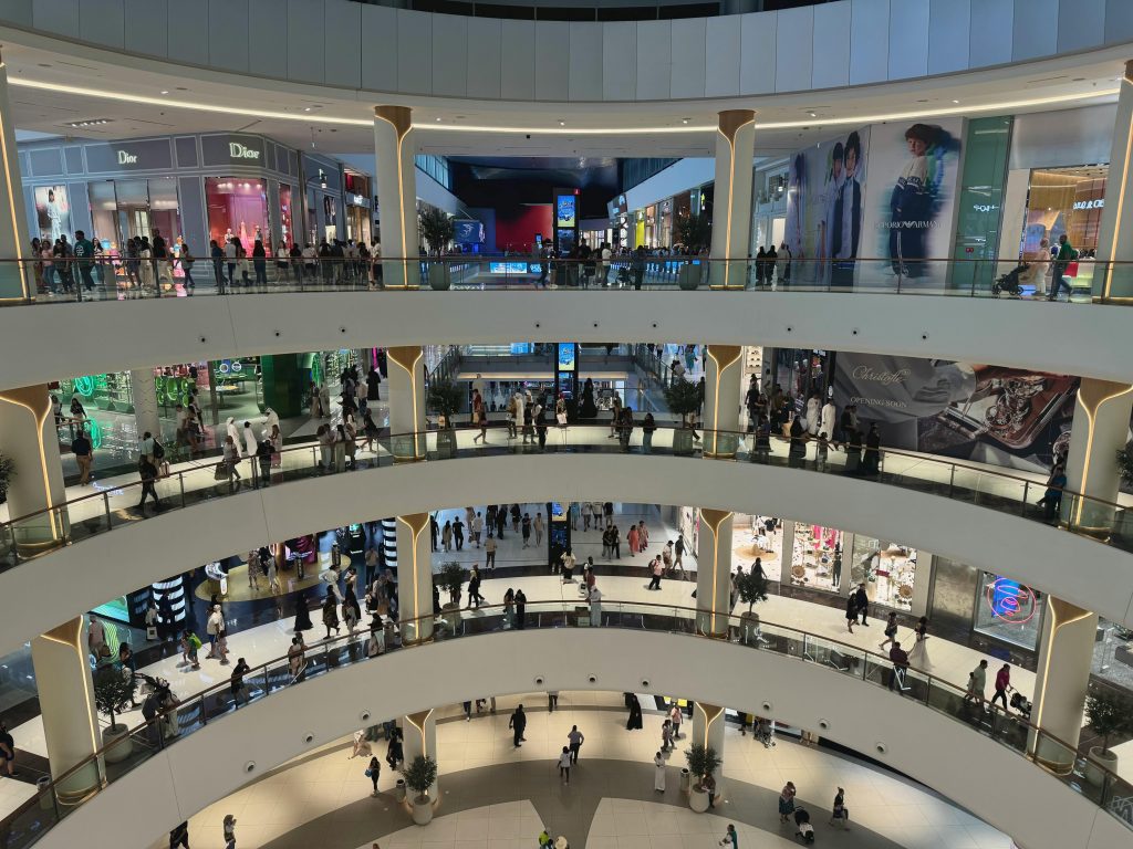 pexels photo 35707831 35707831 Wide-angle view of shoppers in the luxurious multi-level interior of Dubai Mall, the heart of modern retail.